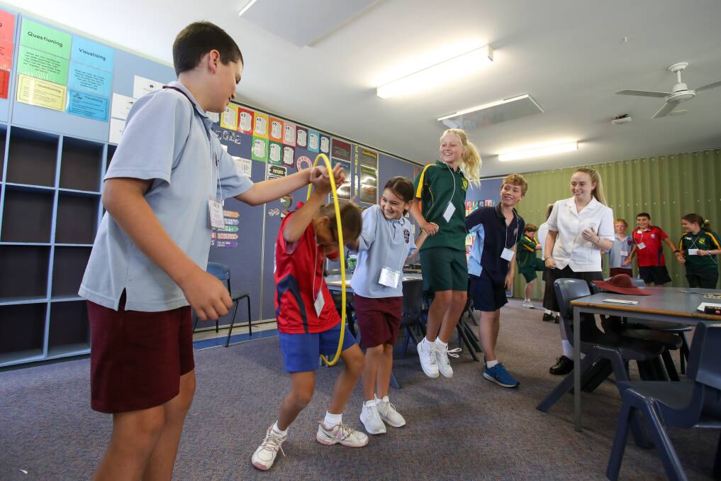 THROUGH THE HOOPS: Students from Stella Maris, Nazareth, St Peter and Paul Kiama and St Paul's Albion Park taking part in an annual Leaders' Day event at the Nazareth Catholic Primary School. Picture: Adam McLean.