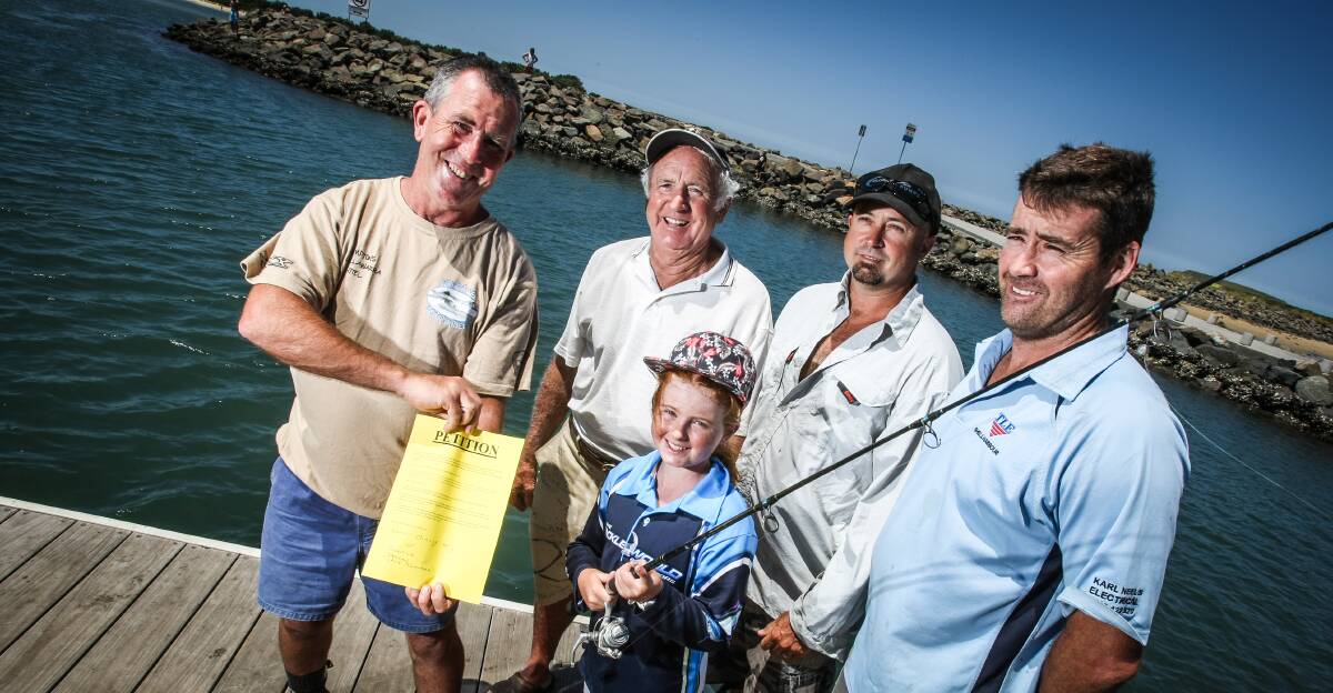 Illawarra fishermen are championing a petition to limit commercial fishing licences in Lake Illawarra. Pictured are Andrew Connor, Brian Leach, Flint Rimmer, Karl Neels and Hayley Leach. Picture: DYLAN ROBINSON