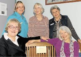 North Kiama Neighbourhood Centre manager Sharon Parker, Mary Wharton, Betsy Coroneos, (front) mayor Cr Sandra McCarthy and the late Ruth Devenney's sister Shirley Gordon with the seat dedicated in Mrs Devenney's memory. Picture: DAVID HALL